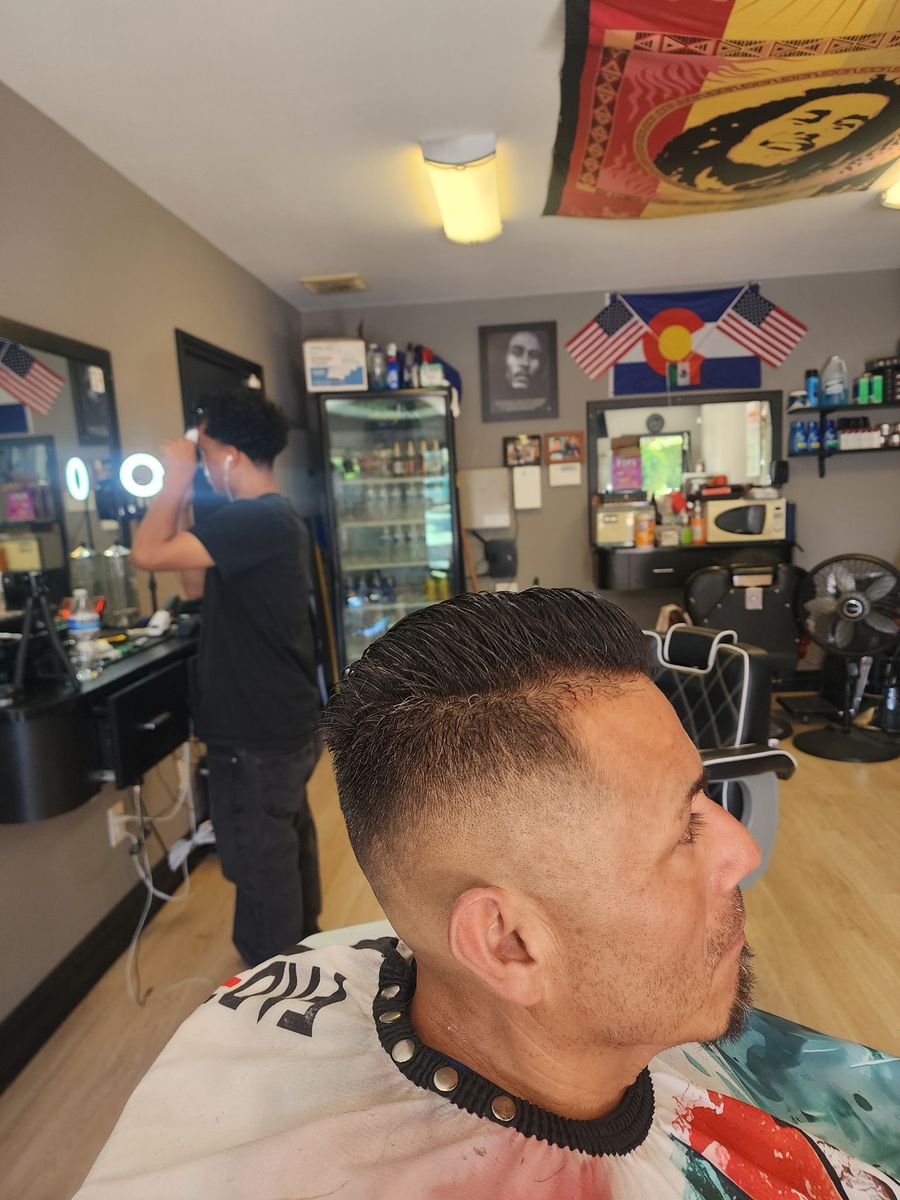 A fresh fade finished at Champ's, seen from the side