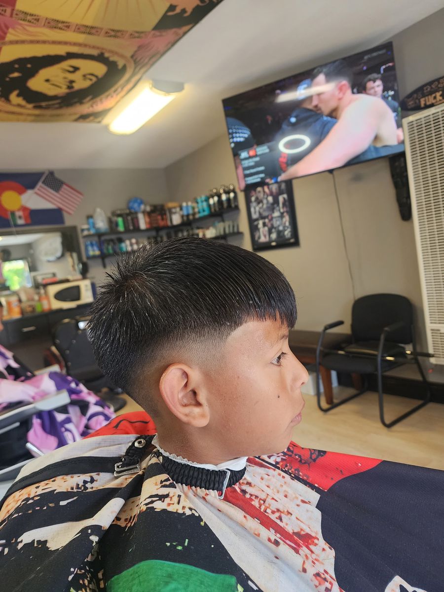 A young customer's finished fade at Champ's