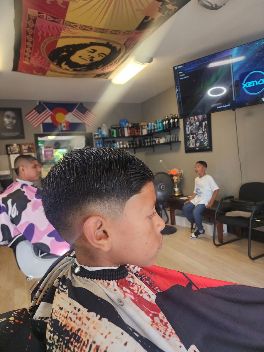 A boy's fresh cut in the chair at Champ's